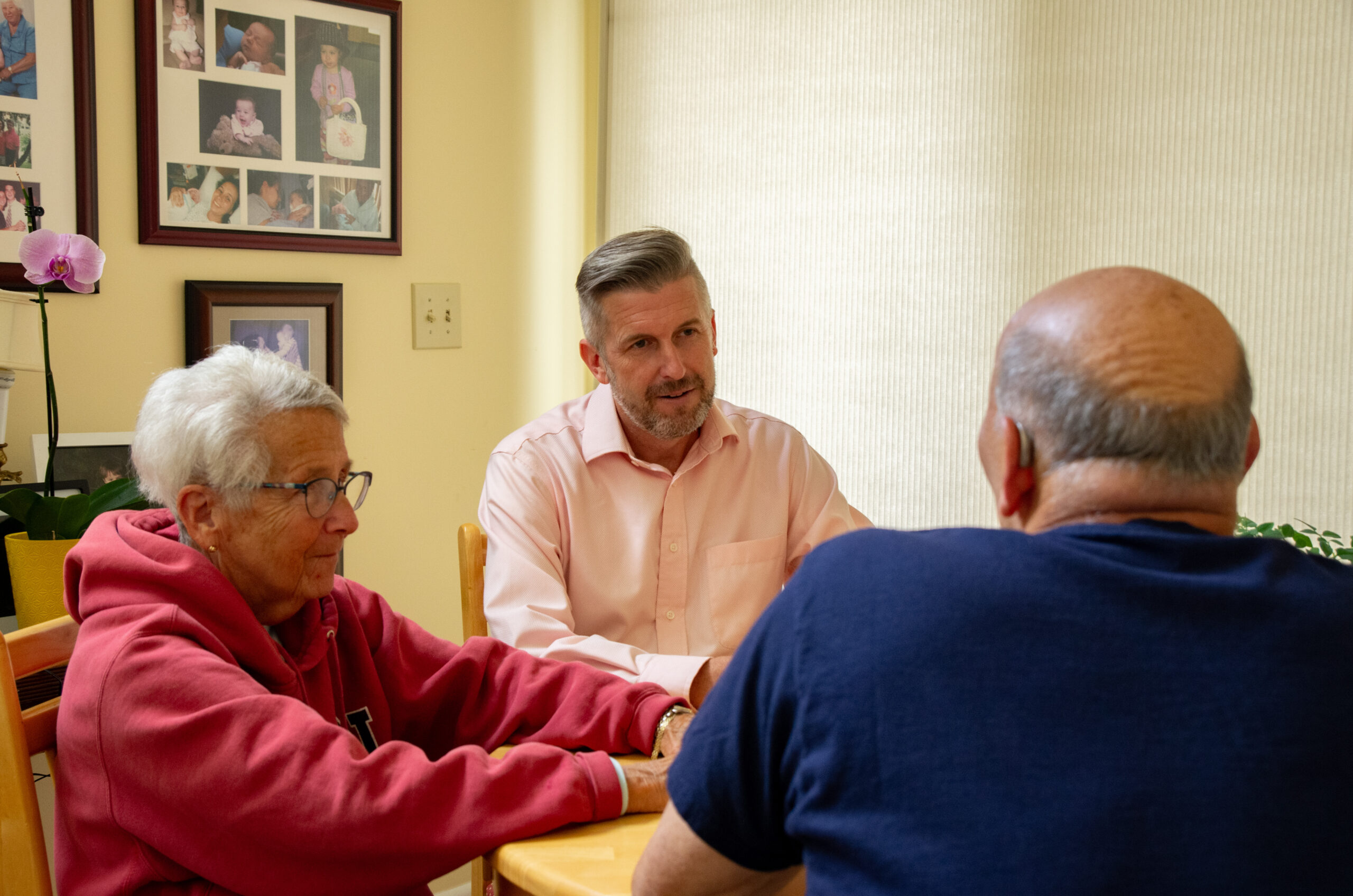 State Senator James Maroney speaks with Debbie and Paul Davis